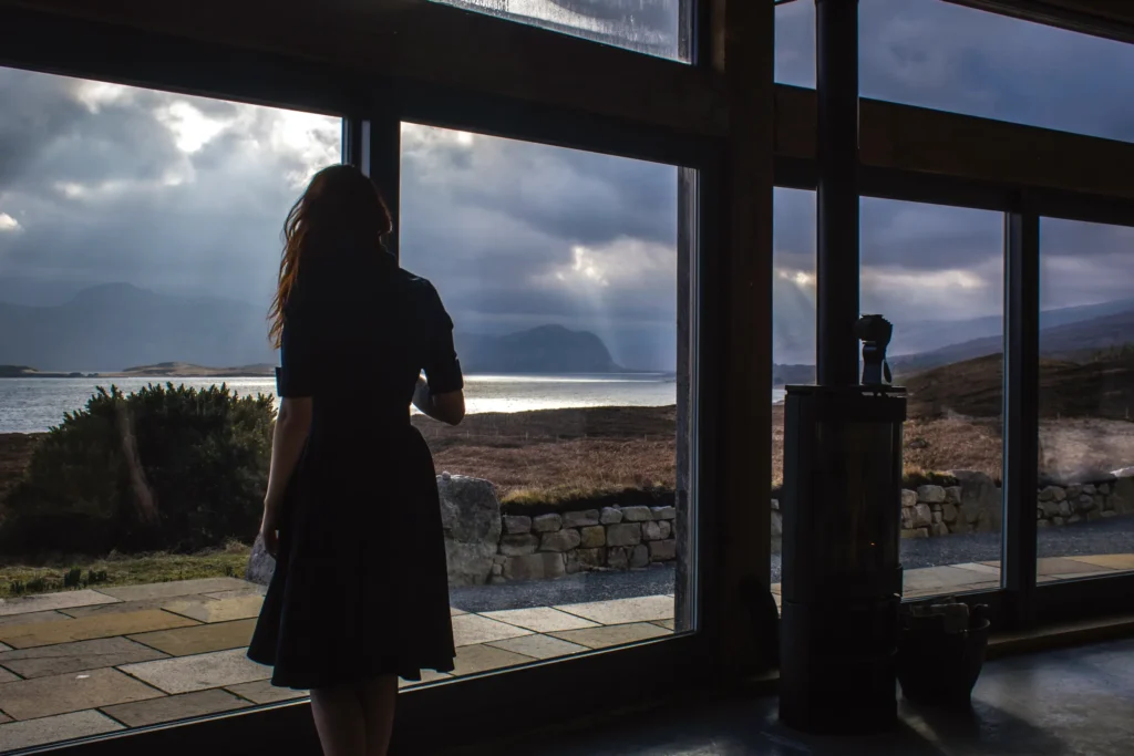 Woman looking at the view outside the window